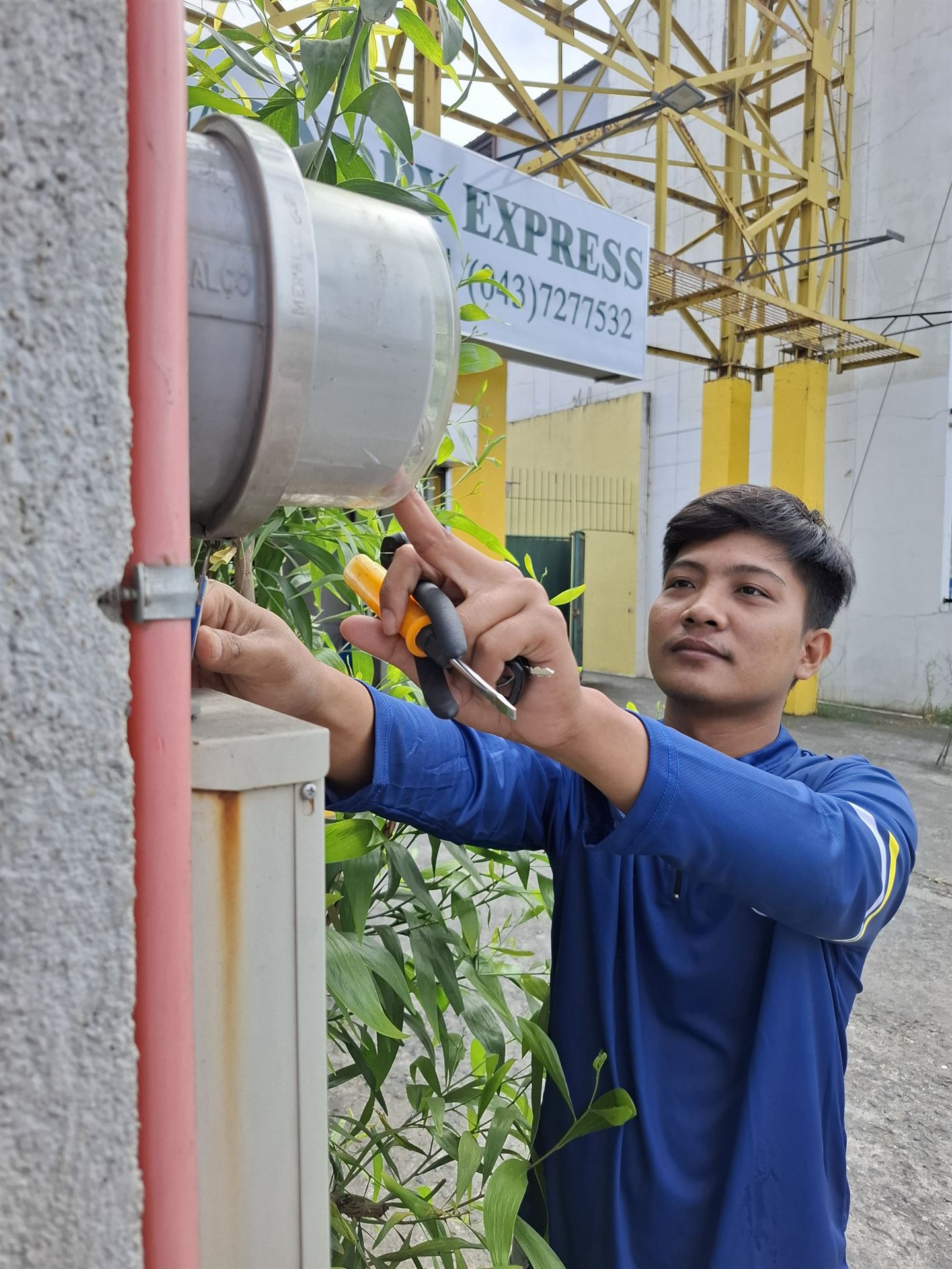 USI field technician conducting meter reading and spot billing for an electric cooperative in the Philippines