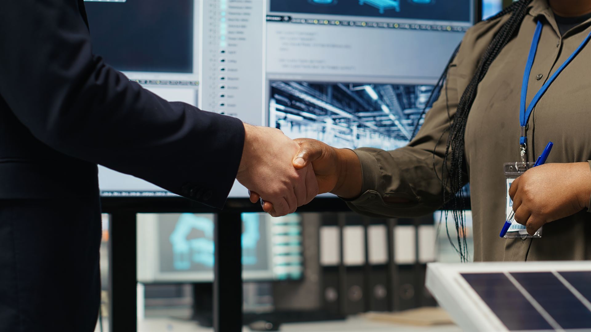 USI representatives shaking hands with utility industry partners